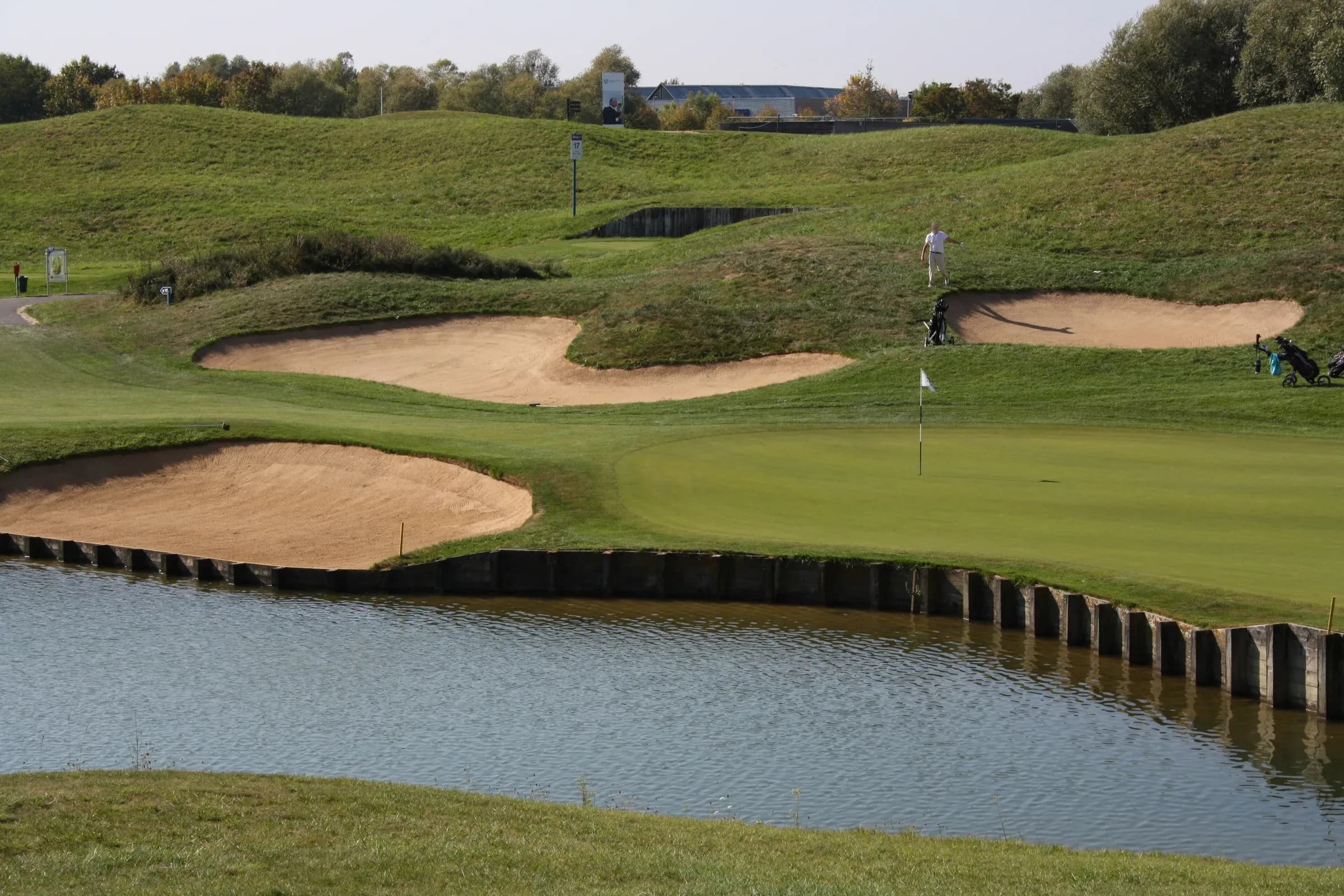 Green, bunkers and water hazard at the Golf national in Saint-Quentin-en-Yvelines