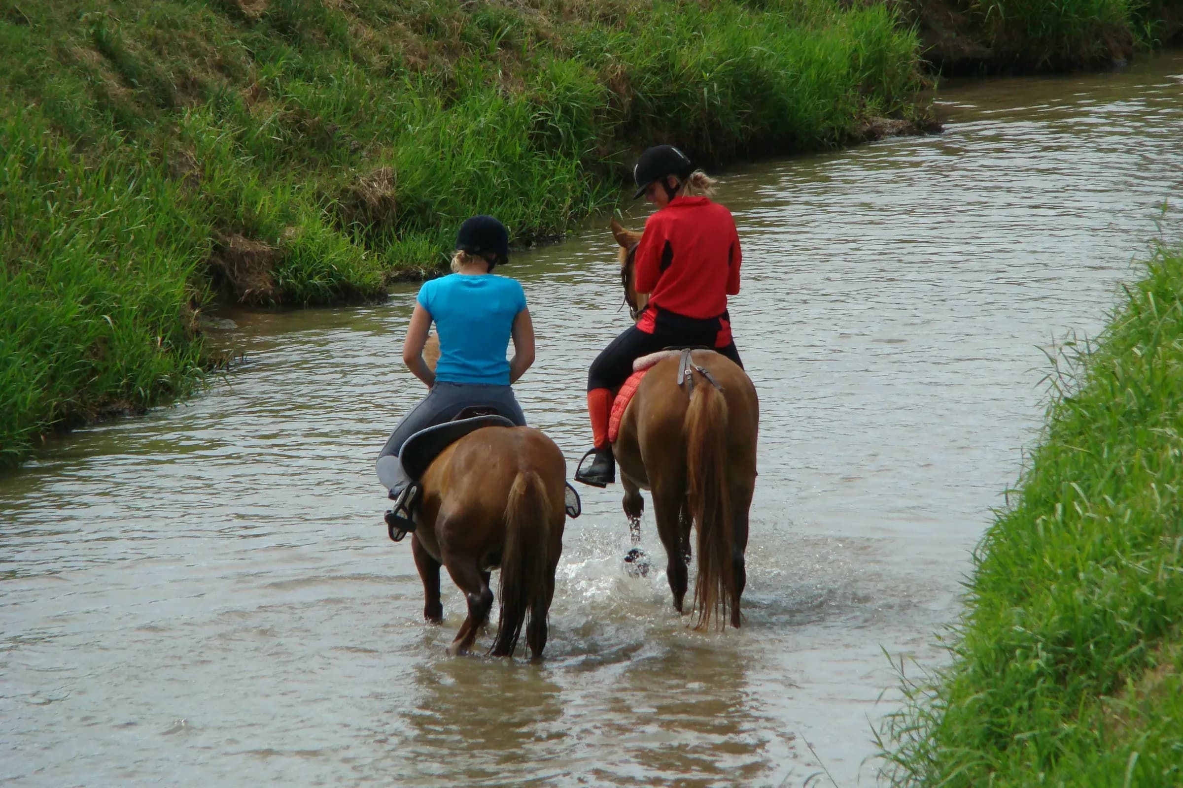 Two riders on horseback fording the Beuvron in Lamotte-Beuvron